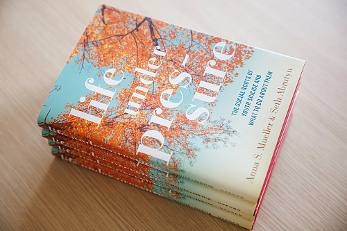 Copies of Life under pressure: The Social Roots of Youth Suicide and What to Do About Them by IU Professor Anna Mueller.