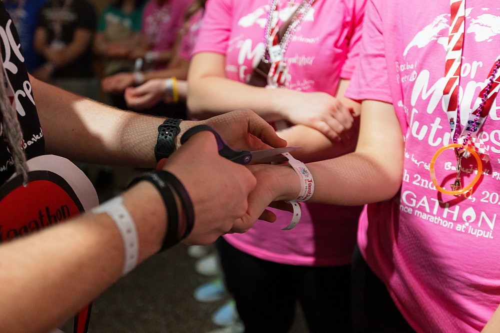 Participants cut their wristbands as a reminder of all the children who are currently still in the hospital.