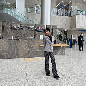 Faith Odiete in front of the Sejong National Research Complex in Seoul, South Korea. Photo provided by Faith Odiete