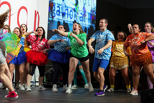 Students dance on stage during the 23rd annual Jagathon Dance Marathon. 