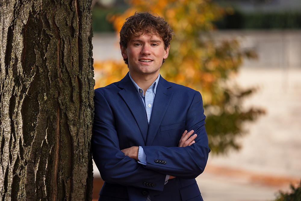 Luke Lonneman, a student at IUPUI in the Kelley School of Business, poses for a photograph outside University Library.