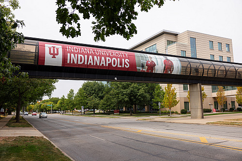 IU Indianapolis banner on the east side of the New York Street gerbil tube (skywalk). The photo was taken on Thursday, Sept. 21, 2023. (P...