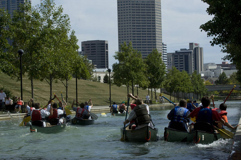 Canoes race at IUPUI's first Regatta. 